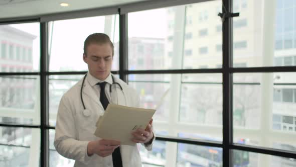 A Caucasian Male Medical Professional Walks Up To The Camera (6 Of 10)