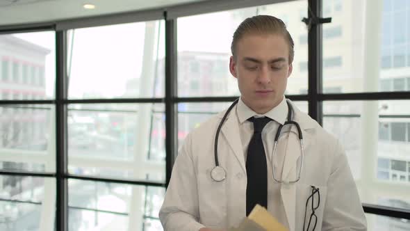 A Caucasian Male Medical Professional Walks Up To The Camera (7 Of 10)