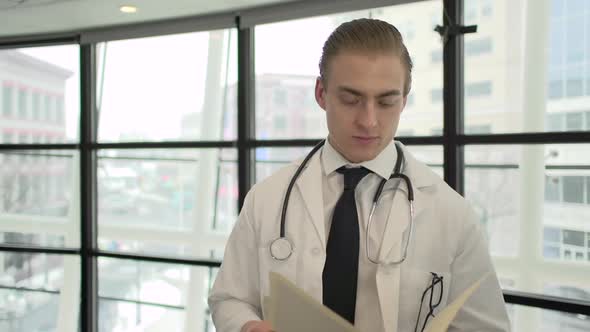 A Caucasian Male Medical Professional Walks Up To The Camera (8 Of 10)