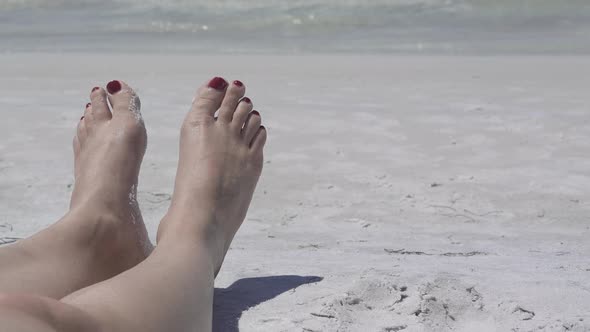 View Of Feet Relaxing On The Beach (2 Of 4)