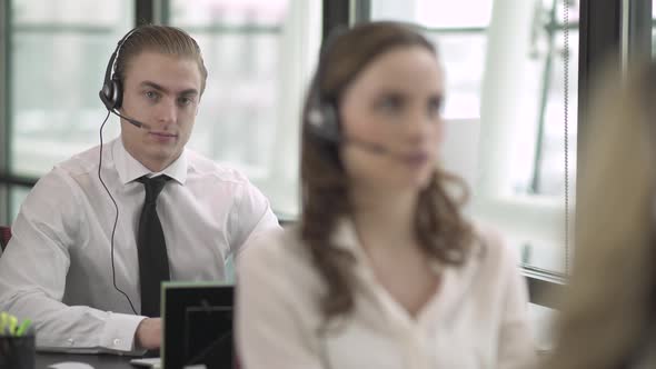 Blonde Caucasian Man Works In A Attractive Modern Call Center (4 Of 4)