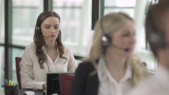 Caucasian Woman Works In A Attractive Modern Call Center (3 Of 4)