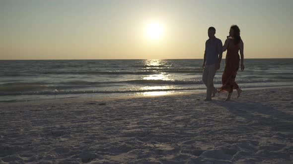 Couple Walking On Beach At Sunset (1 Of 23) alt