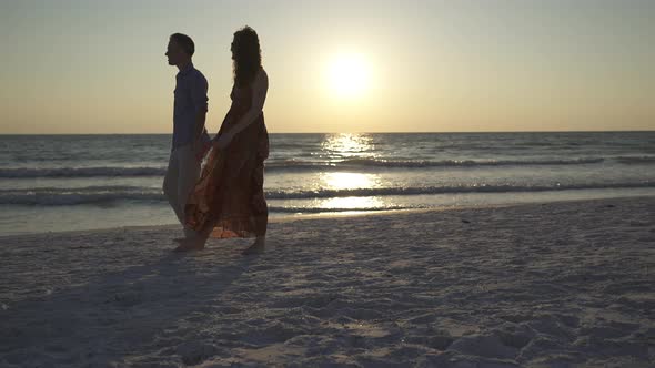 Couple Walking On Beach At Sunset (10 Of 23)