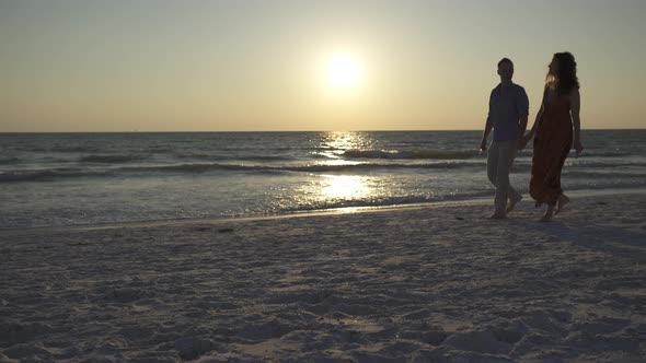 Couple Walking On Beach At Sunset (15 Of 23)