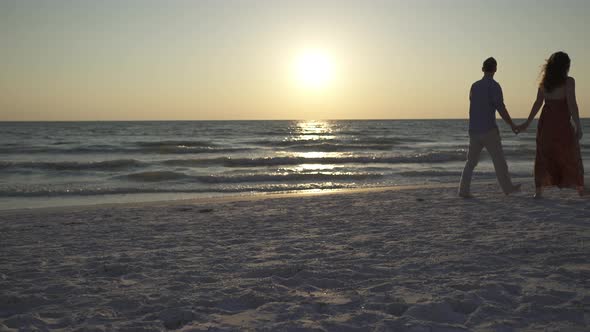 Couple Walking On Beach At Sunset (22 Of 23)