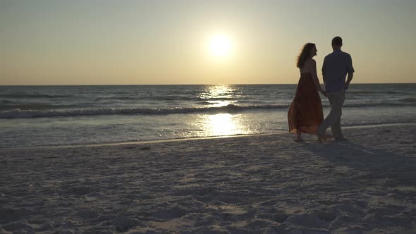 Couple Walking On Beach At Sunset (7 Of 23)