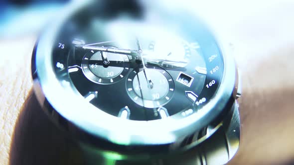 Macro shot black silver watch wrist sophisticated technology time is money
