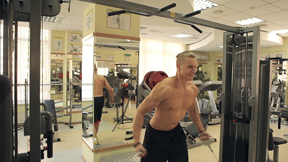 Men Exercising In Gym