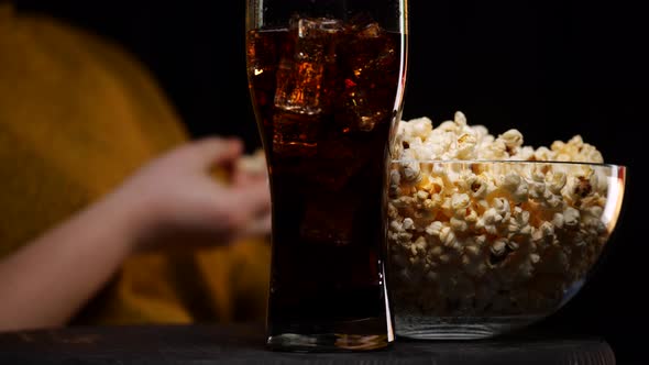 Crop Person Eating Popcorn During Show Time