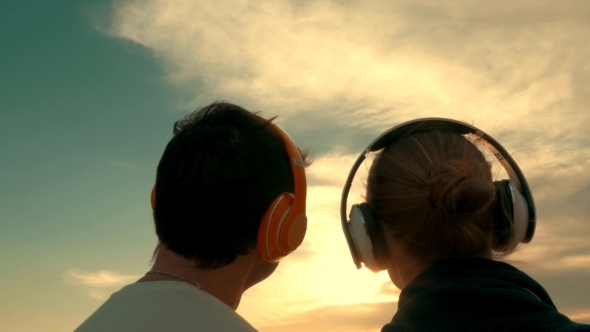 Couple Listening To Music Outdoors