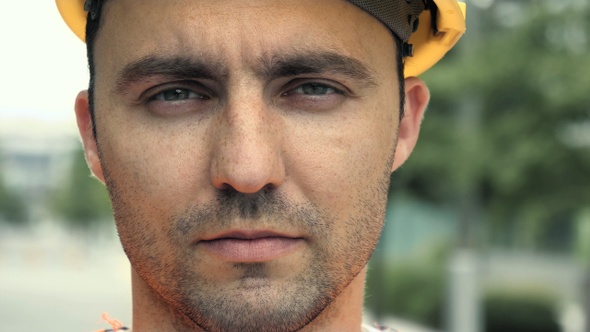 Portrait of Male Industrial Worker Wearing Helmet Looking