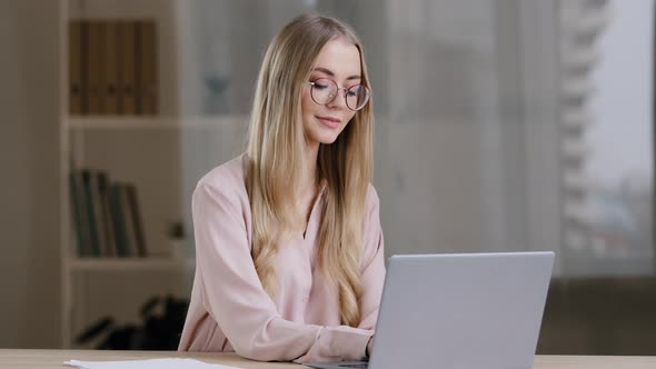 Caucasian Millennial Business Woman Female Student Girl Writer Journalist Wearing Glasses Sitting at