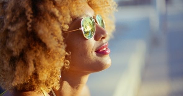 Close Up Portrait Of Exotic Girl With Afro Haircut alt