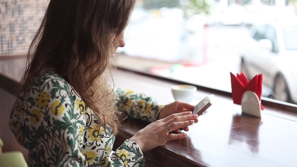 Candid Image Of a Young Woman Using Smartphone