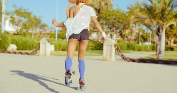 Sexy Back Of Riding Girl On Roller Skates