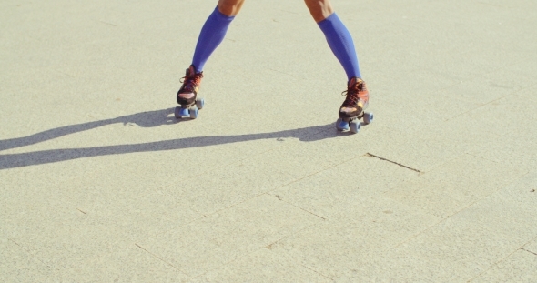 Close Up Of Girl Riding Roller Skates