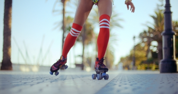 Low Angle Shot Of Roller Skating Girl