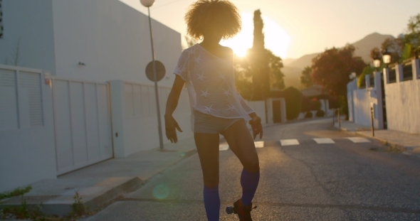 Young Woman Riding On Roller Skates