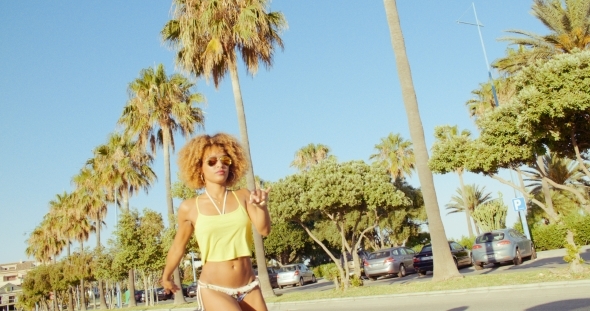 Sexy Girl Riding On Roller Skates On Exotic Street alt