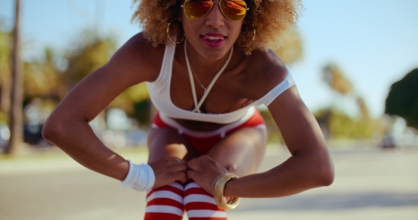 Sexy Happy Girl Doing Poses On Her Roller Skates alt