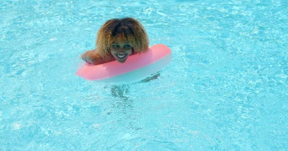Cute Girl Playing In Swimming Pool