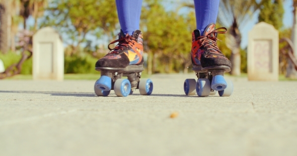 Low Angle Video Of a Girl Riding Roller Skates
