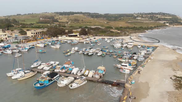 Drone footage of Boats moored at the harbor of Marsaxlokk, Malta