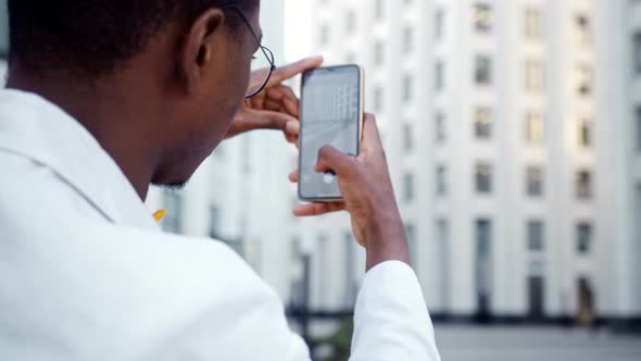 Black guy turns to shoot office building as tourist attraction