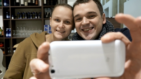 Lovely Couple In Cafe Making Selfie