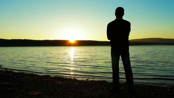 The Lonely Man Longs And Looks At A Sunset.