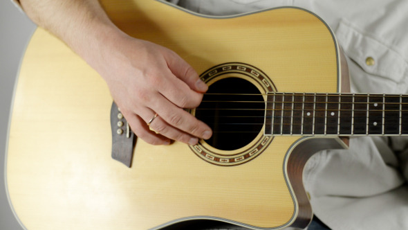 Hand Playing on Guitar