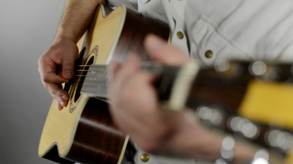 Man Starts Playing Guitar