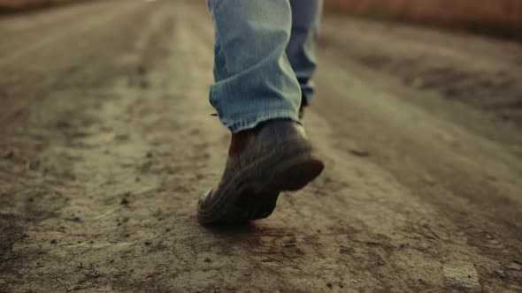 Rubber Boots Walking Rural Road Closeup at Countryside Alone