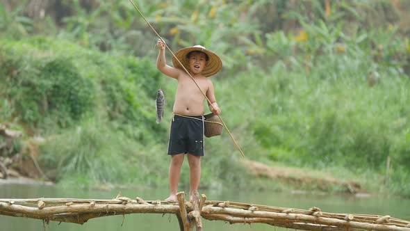 Happy Boy Catches A Fish