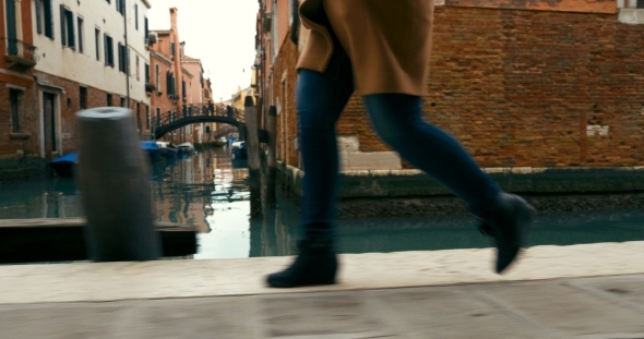 Woman In Haste Moving Along Venetian Canal