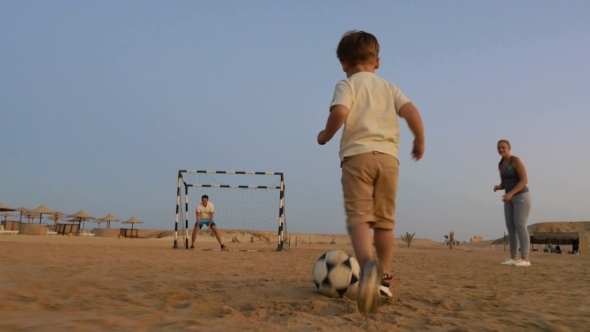 Boy Is Ready To Make a Goal In This Beach Football