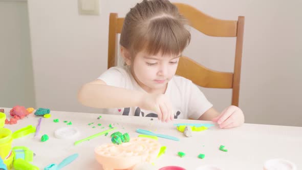Little Girl Playing with Plasticine