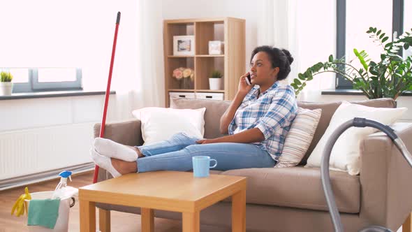 Woman Calling on Smartphone After Home Cleaning