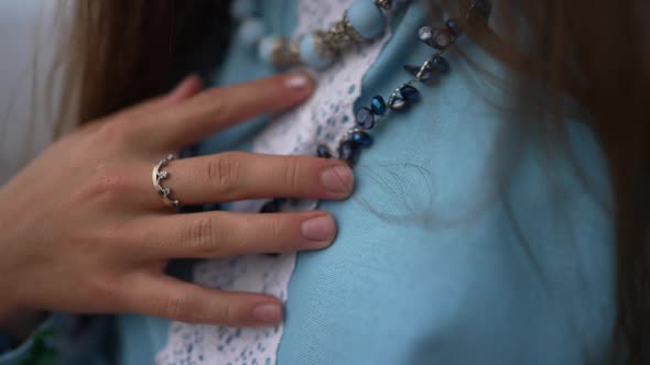 Closeup Unrecognizable Ukrainian Woman in Embroidered Dress Touching Necklace in Slow Motion