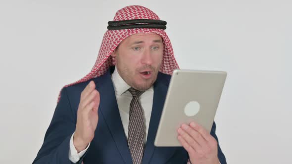 Arab Businessman making Video Call on Tablet, White Background