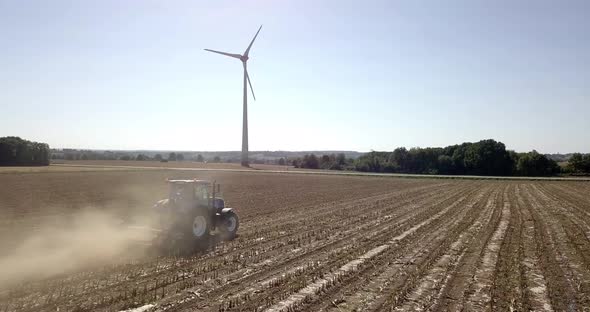 Tractor plows his fields