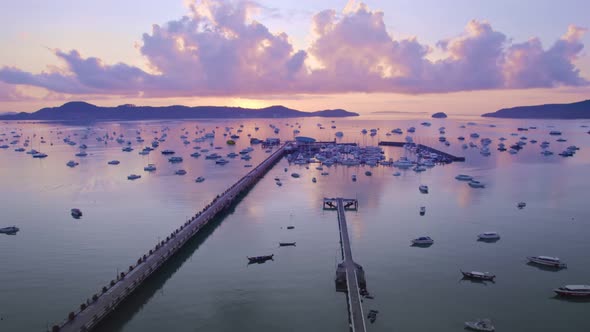 Phuket sea sunrise sky. Aerial view of chalong bay with many boats yachts,longtail fishing boats