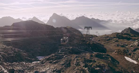 Cable Car View of Rocky Mountain Ground, Beautiful Snowy Mountain Range Landscape in Background in a