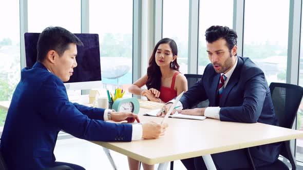 Smart Businessman and Businesswoman Talking Discussion in Group Meeting