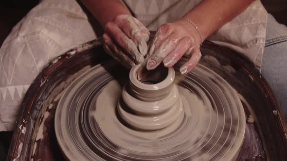 Pottery Workshop  Female Hands Shaping the Clay on the Wheel