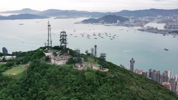 Top of Castle Peak facing Castle Peak Bay. Aerial shot of tower fic in the top of the peak.