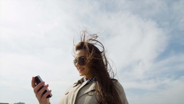 Picture Of Happy Smiling Woman Using Phone Camera