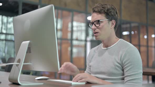 Sick Guy Having Coughing While Working on Computer