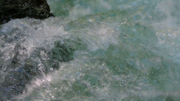 Crystal Water Of River Stream Flowing And